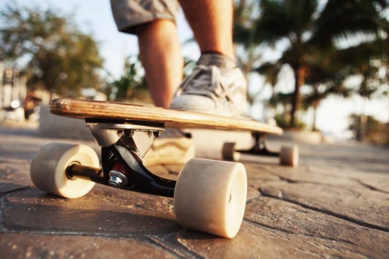 closeup of cruising skateboard wheels and underside of board
