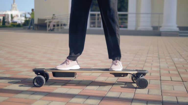 man standing on electric skateboard