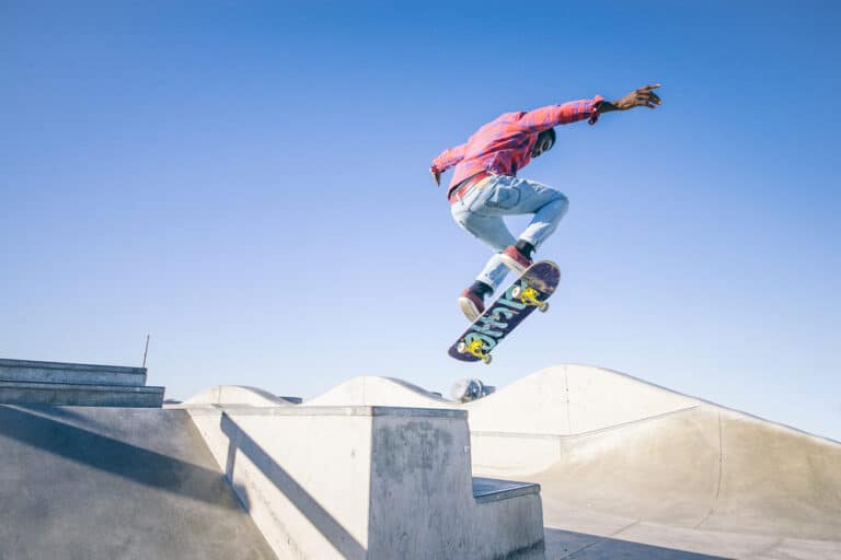 man skateboarding in a concrete skate park